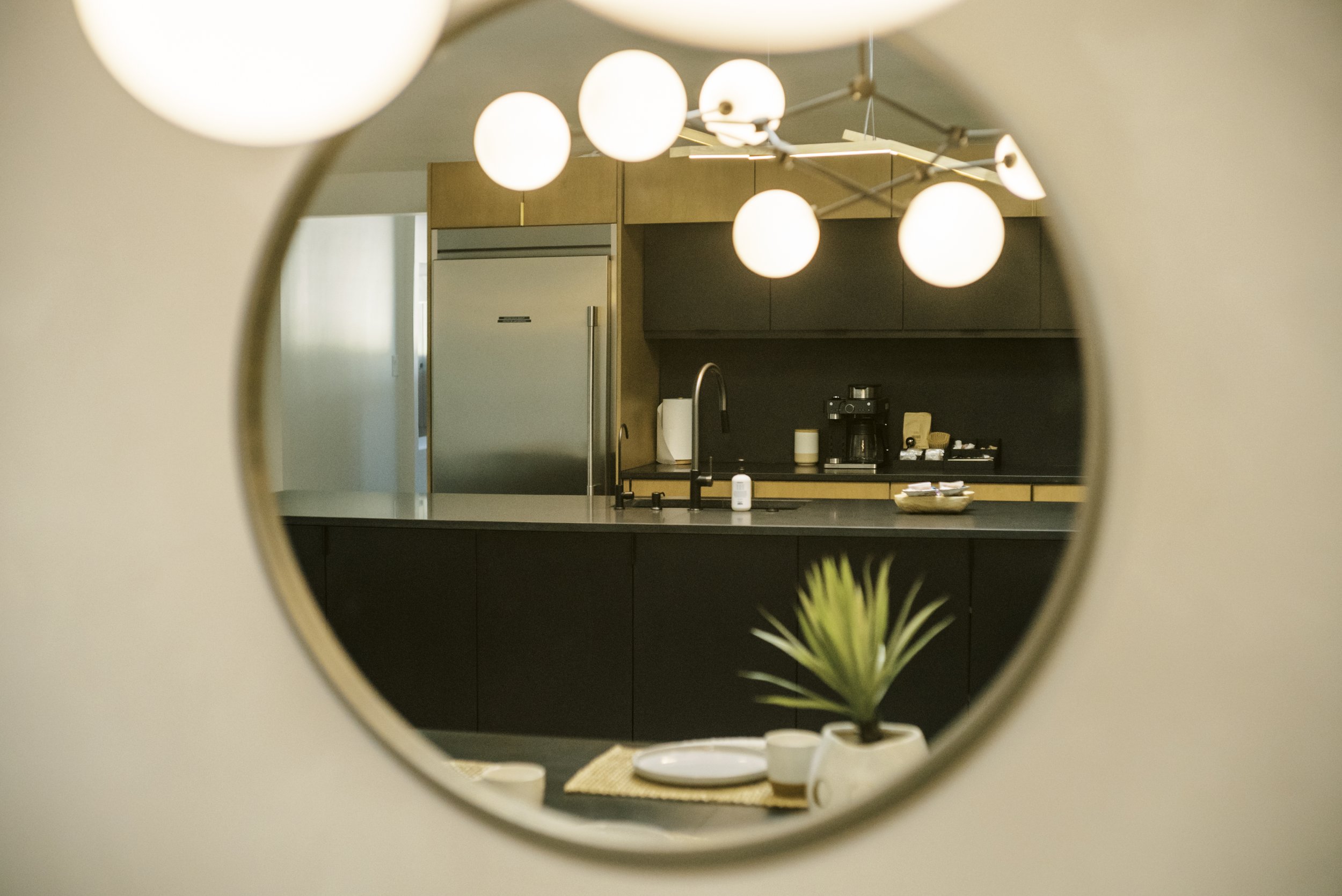 Bright modern kitchen with island seating — real estate photography by Texas Homes Media, Central Texas